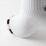 Damier blanc, noir et or